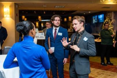 Students talking to an employer at the networking mixer at 竞技宝app下载